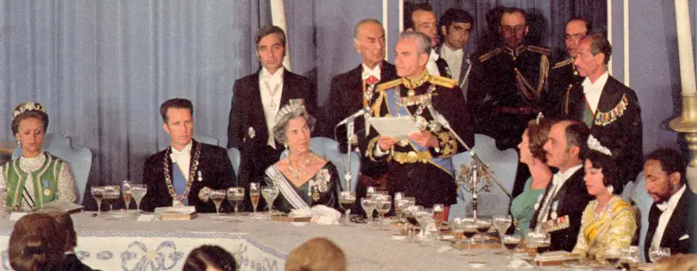 The Shah of Iran delivering a speech at the state banquet. Beside him sits the Queen of Denmark, the King of Belgium, and the King of Jordan. Credit: The Persepolis Celebrations