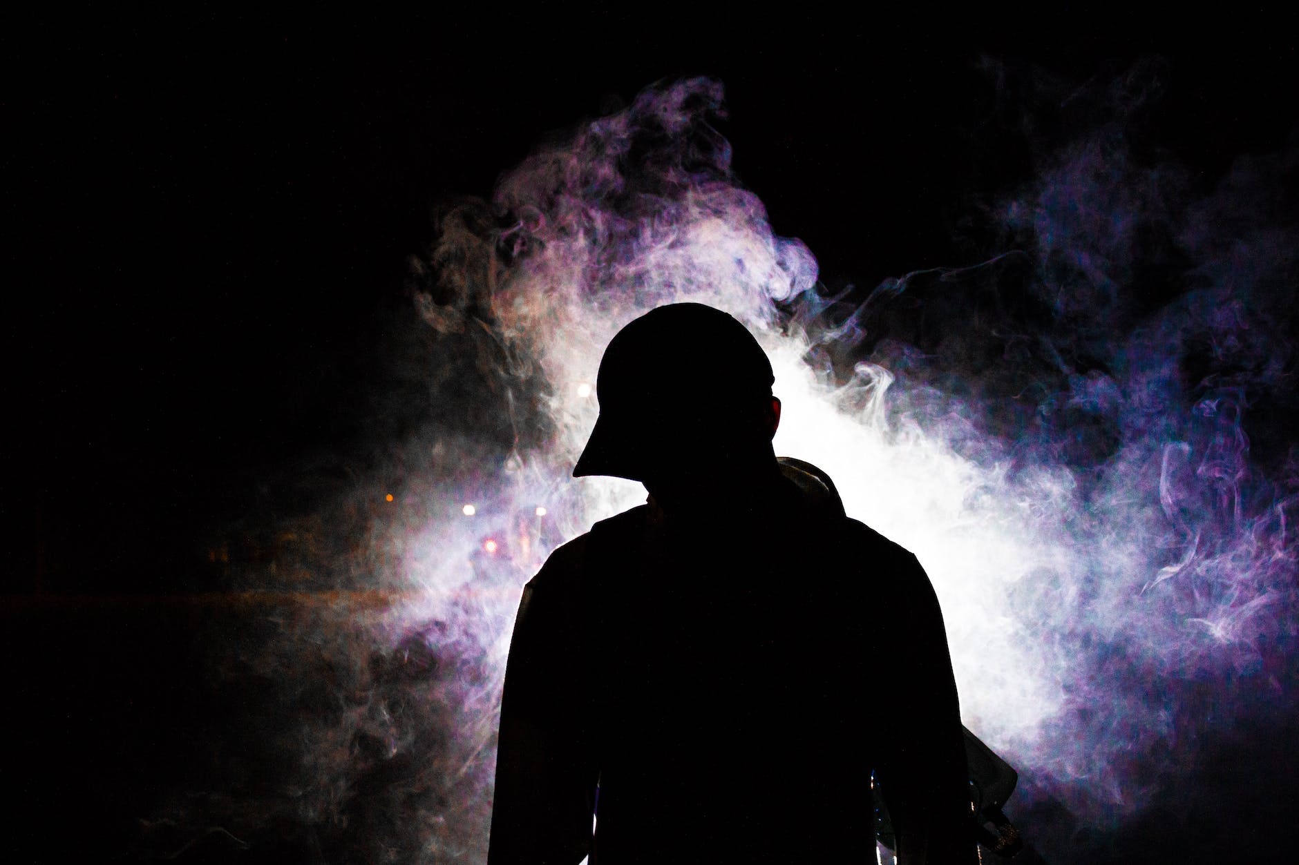 silhouette photography of smoke behind person