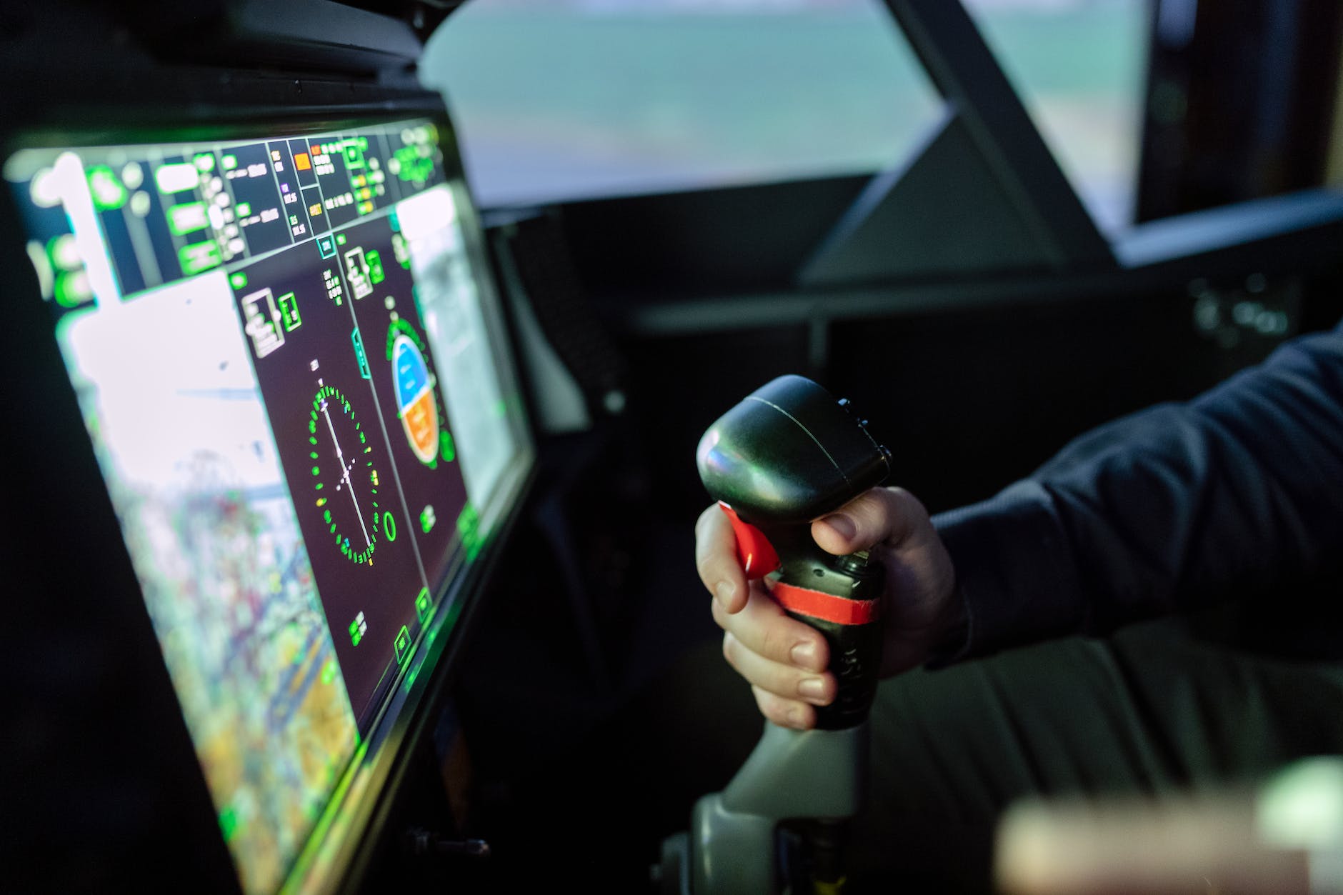 person controlling flight simulator