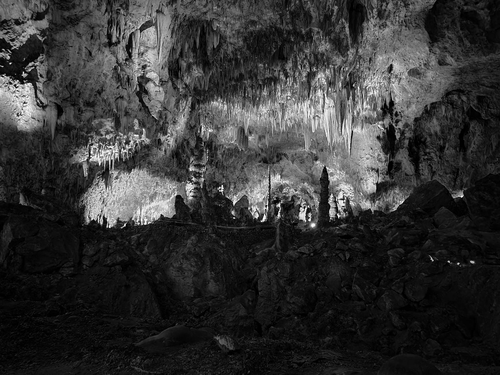 grayscale photo of a cave